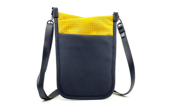 The rear of the P.I.K.A. Pouch in Solaris (yellow with white gridding) 200 Halcyon.